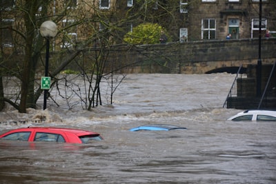 Cars under the water in town flooding.