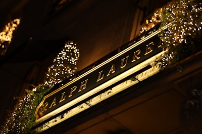 Christmas sign with lights around ralph lauren. 