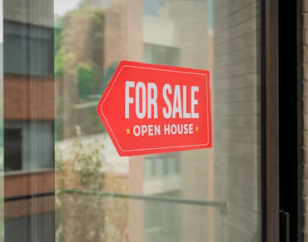 For sale sign on window. 