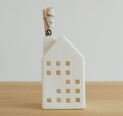 House icon with a 50 dollar bill in chimney,.