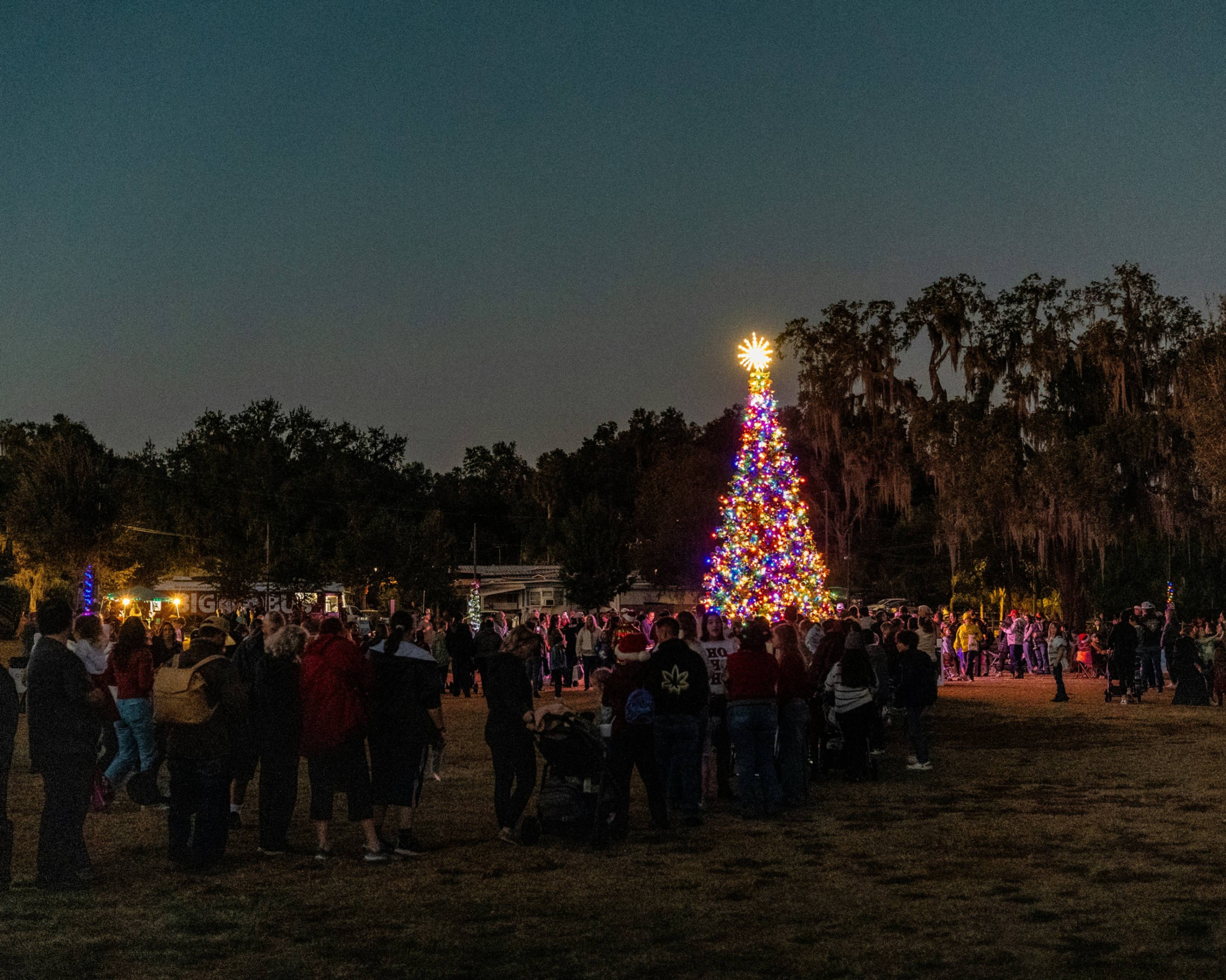 People celebrating christmas outside.