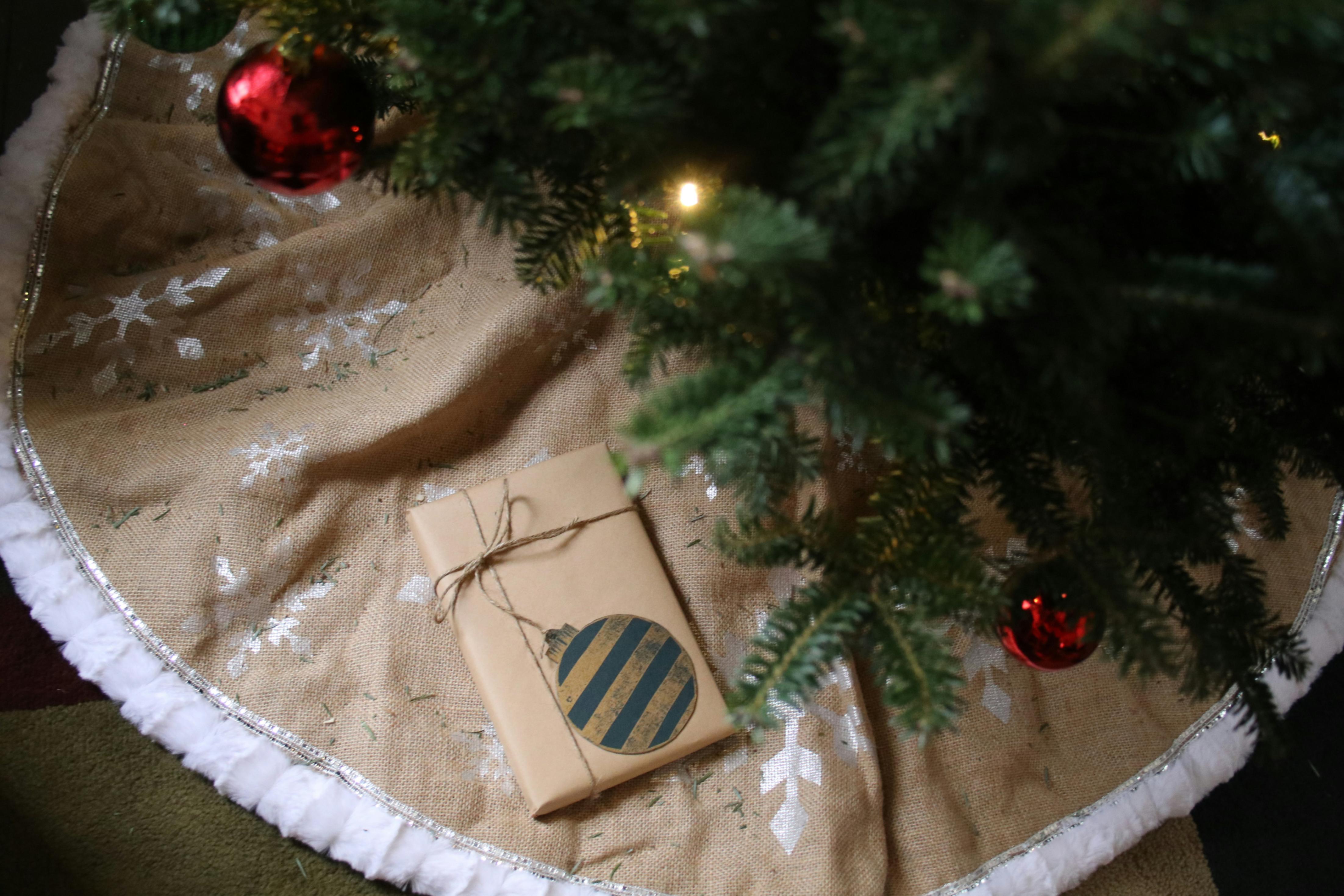 Underneath a christmas tree.