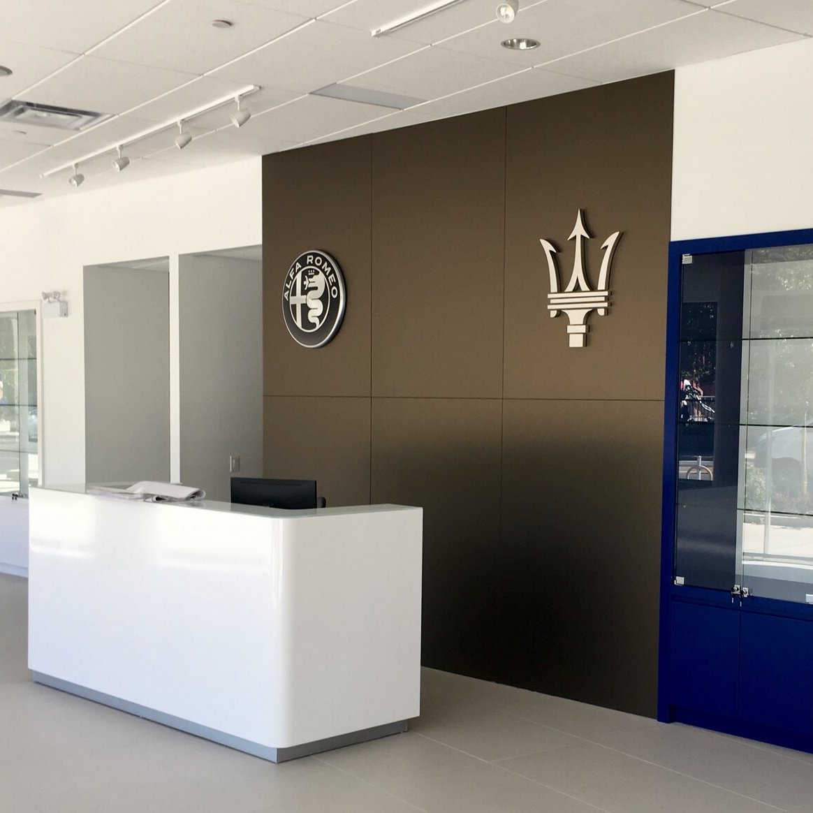 Dealership reception desk in a finished commercial fit-out