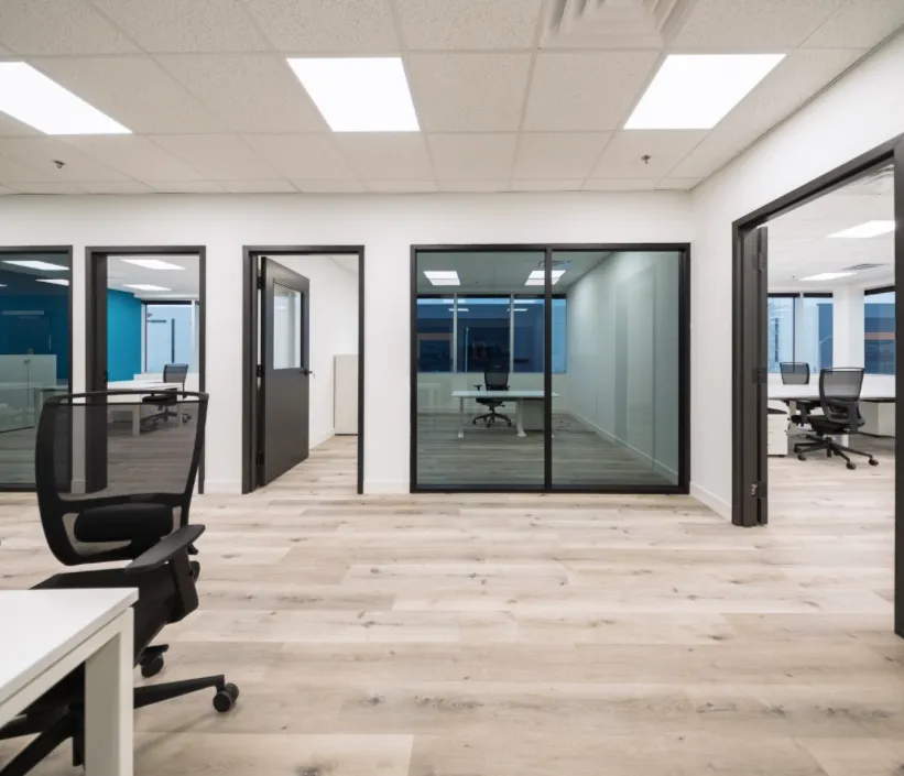 Finished office interior with glass-walled meeting rooms