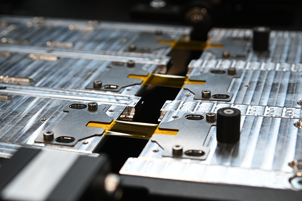 close-up of flexible electronic parts in the bending tester
