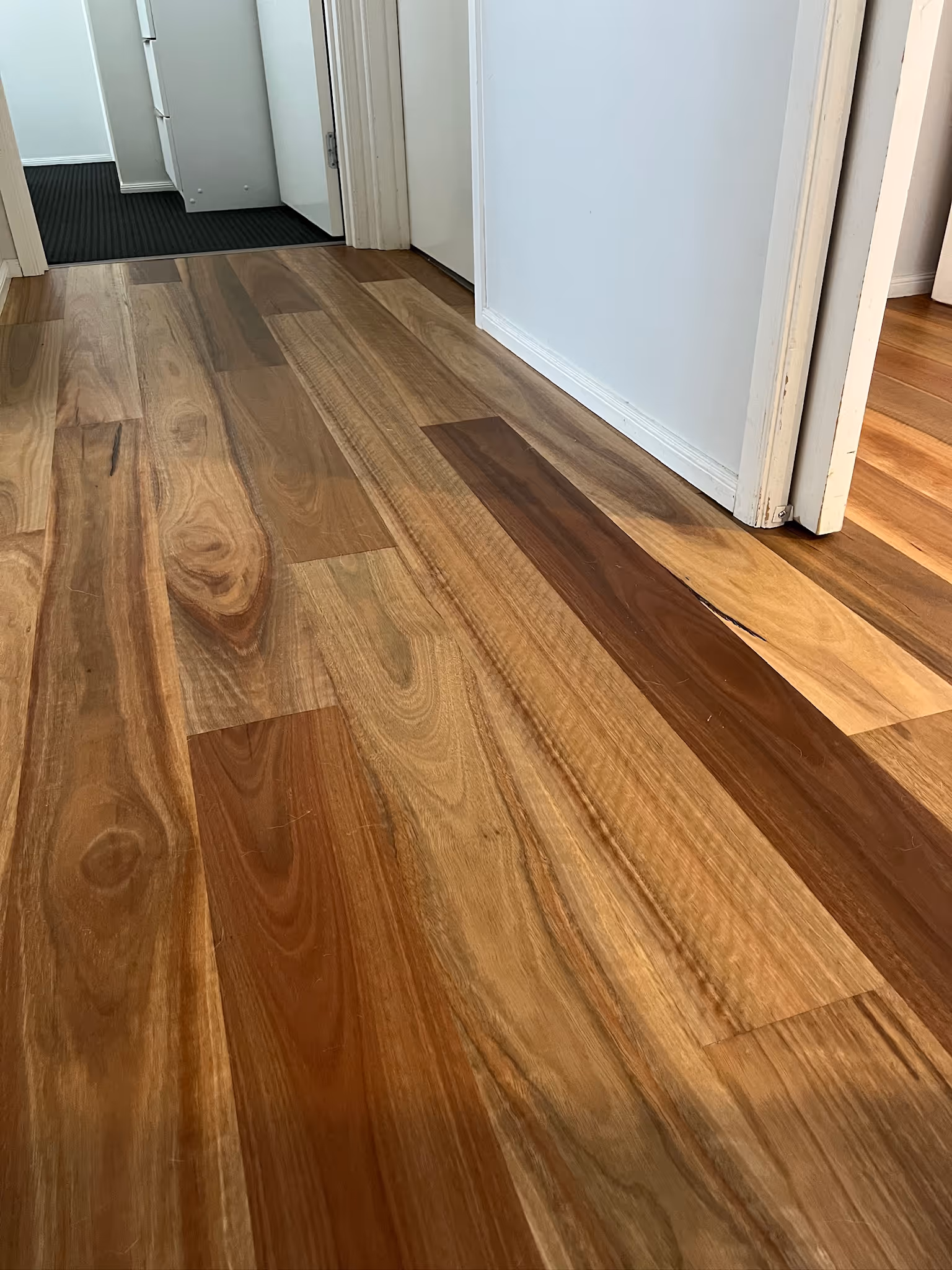 Close-up of engineered timber flooring in a hallway