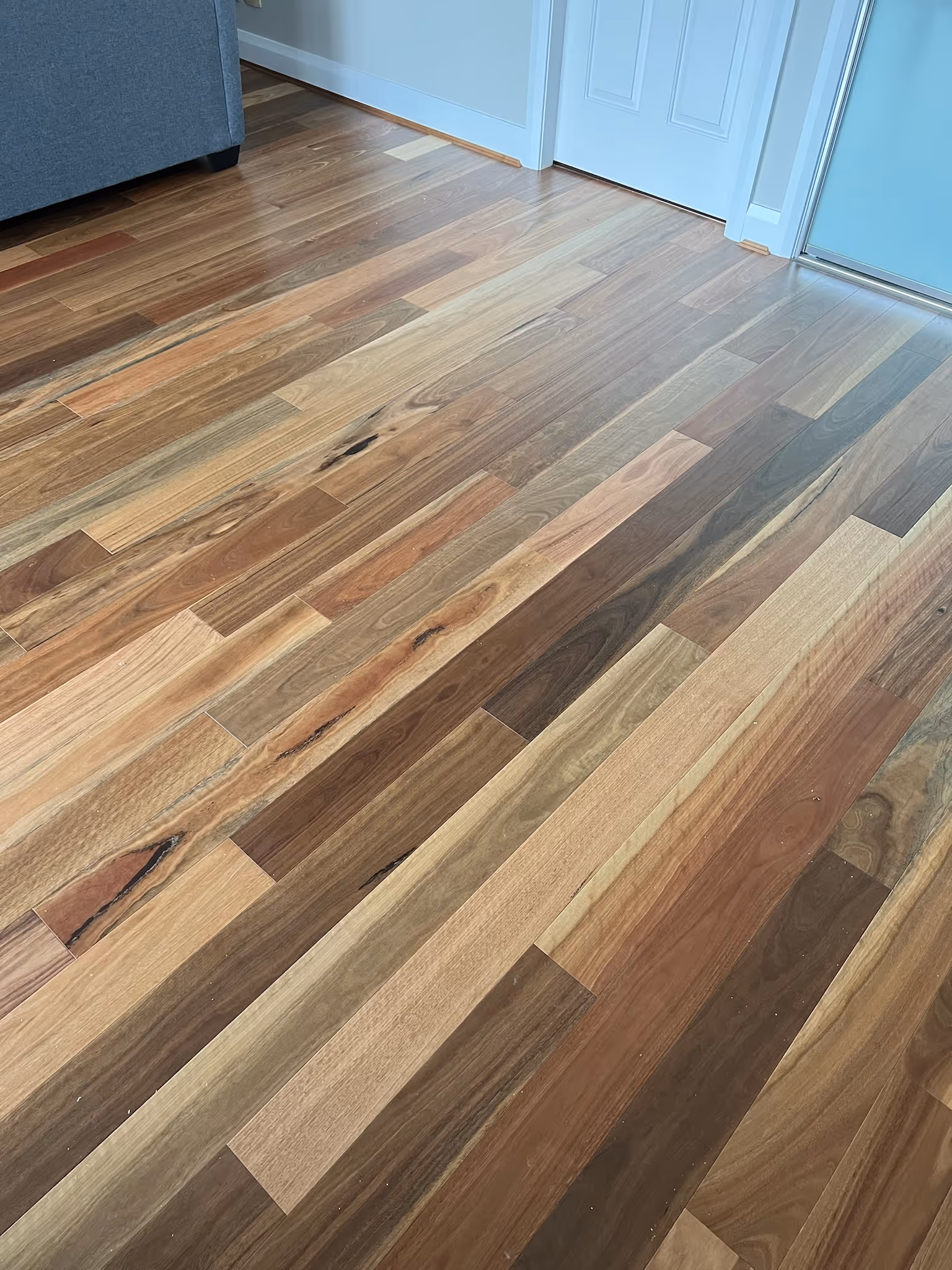Engineered timber flooring featuring contrasting wood tones that create visual interest and depth.