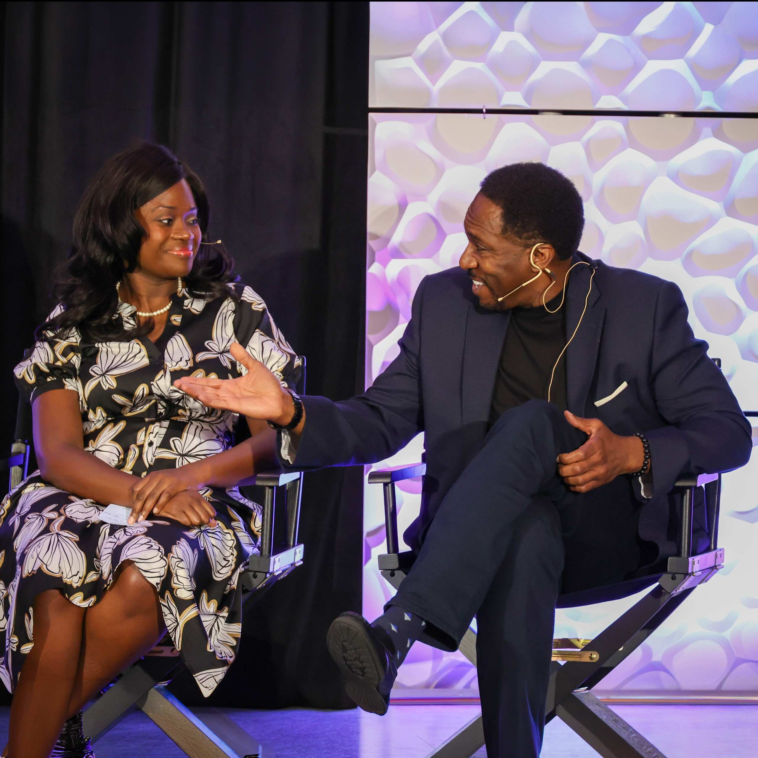 Two panelists sharing ideas on stage at an IPMI Institute