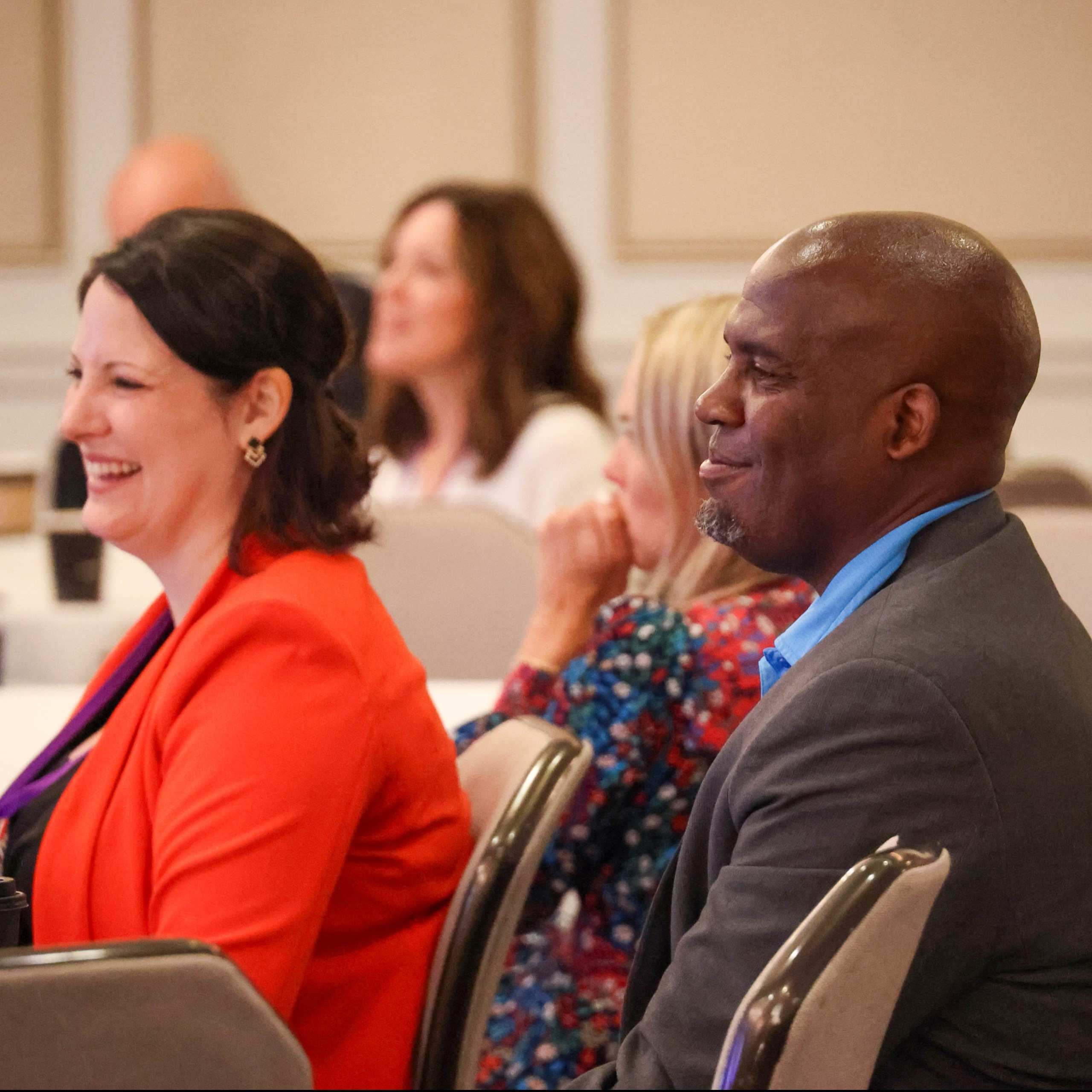 Attendees listening and smiling during an IPMI Institute session