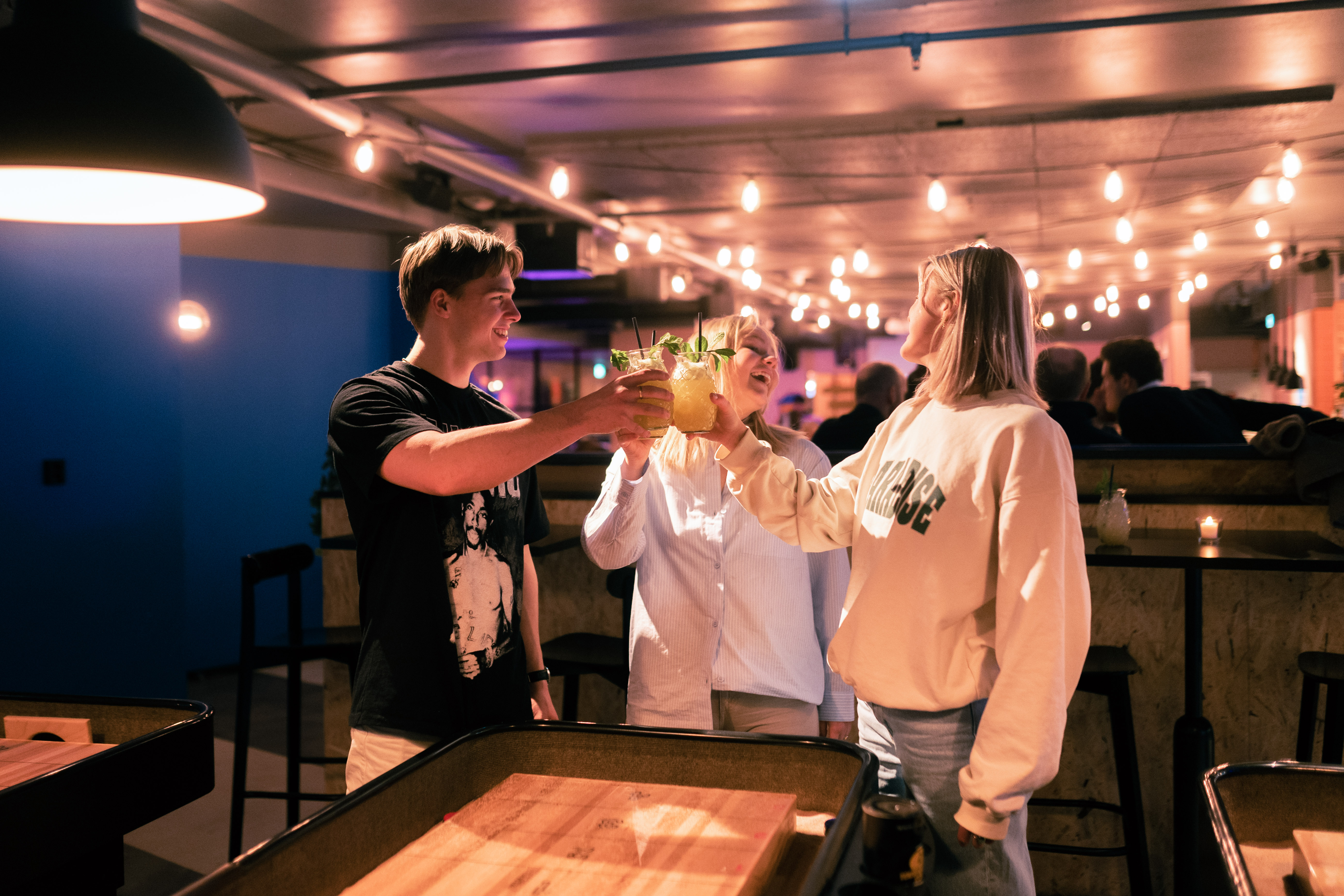 Some friends sharing a couple of drinks at PINPIN