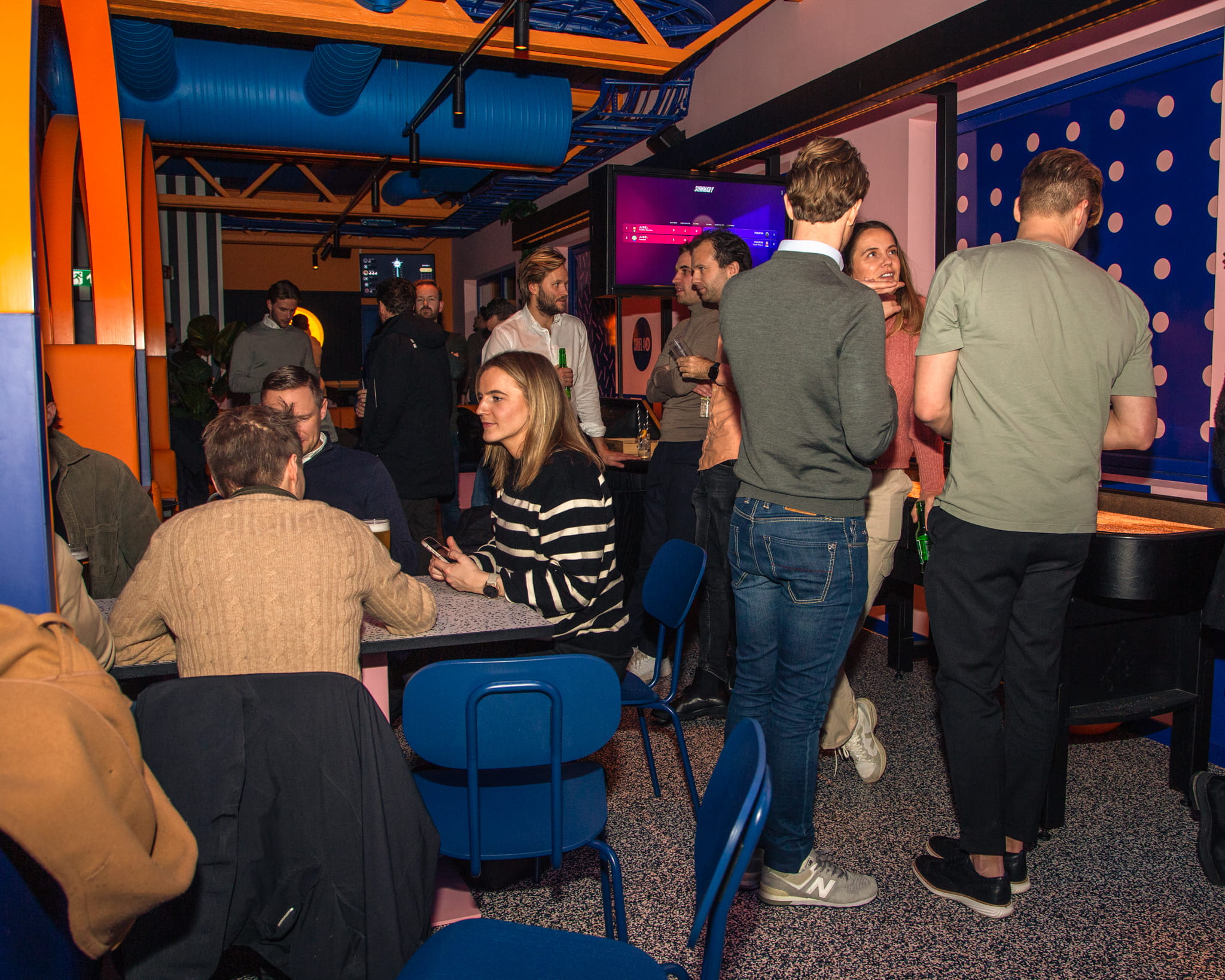 A picture of a big group of people having fun at the PINPIN venue