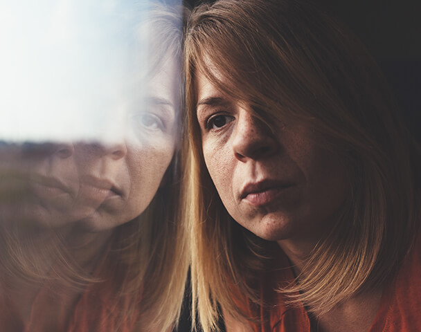 A woman experiencing emotional discomfort during rest