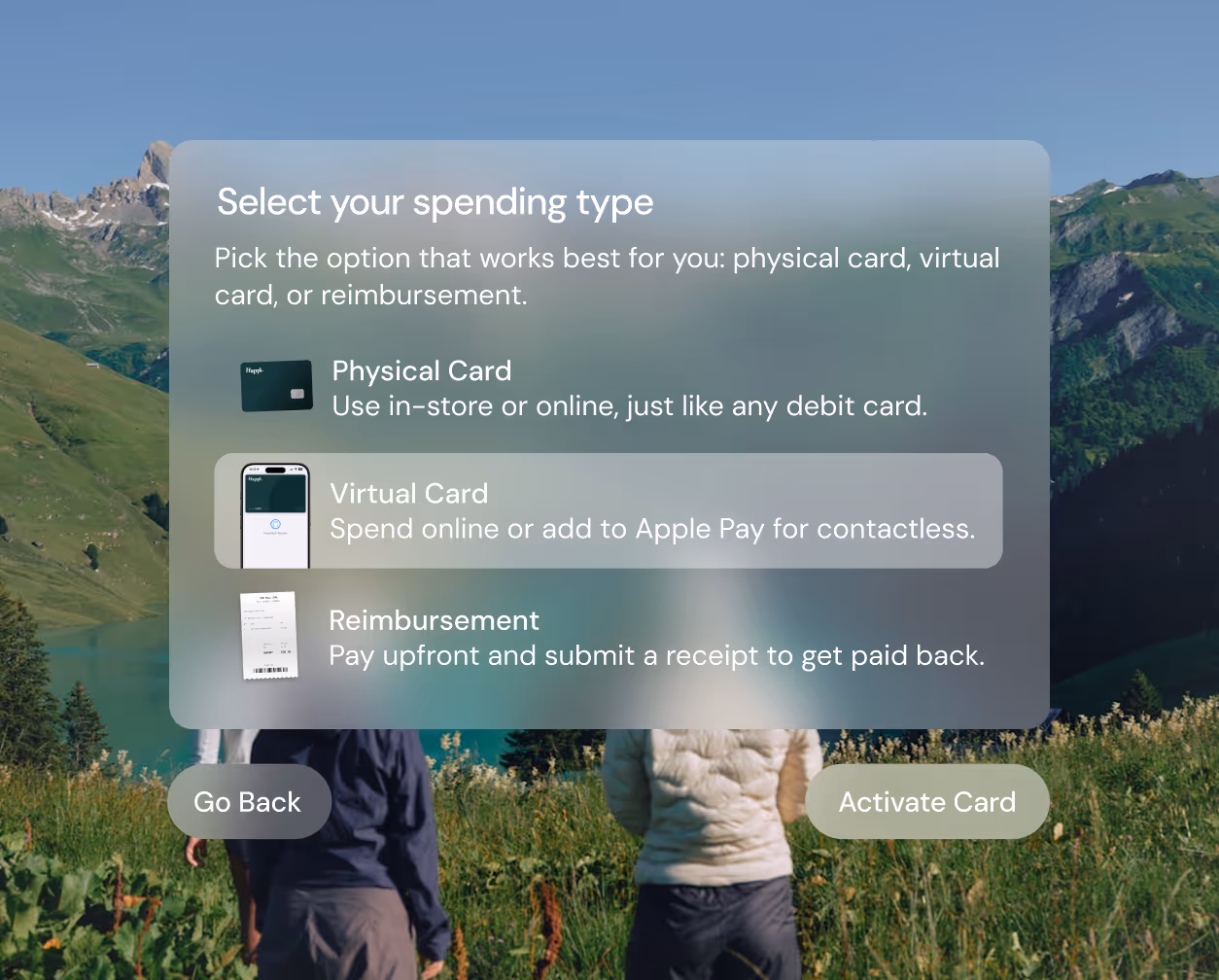 User interface for selecting spending type with options: Physical Card, Virtual Card (highlighted), and Reimbursement, over a background of two people in a field with mountains.