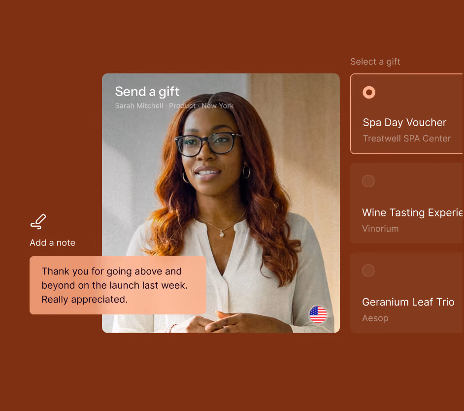 Screen showing a woman with glasses and long red hair, wearing a white blouse, with text 'Send a gift' and a note saying 'Thank you for going above and beyond on the launch last week. Really appreciated.' Options to select gifts on the right including Spa Day Voucher, Wine Tasting Experience, and Geranium Leaf Trio.