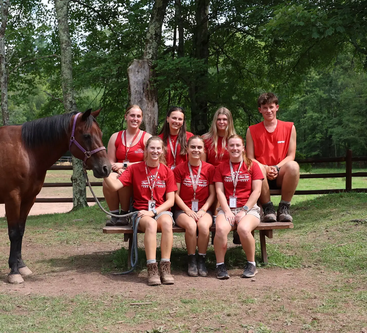 Camp counsellors at Camp Chipinaw posing for a photo with a horse