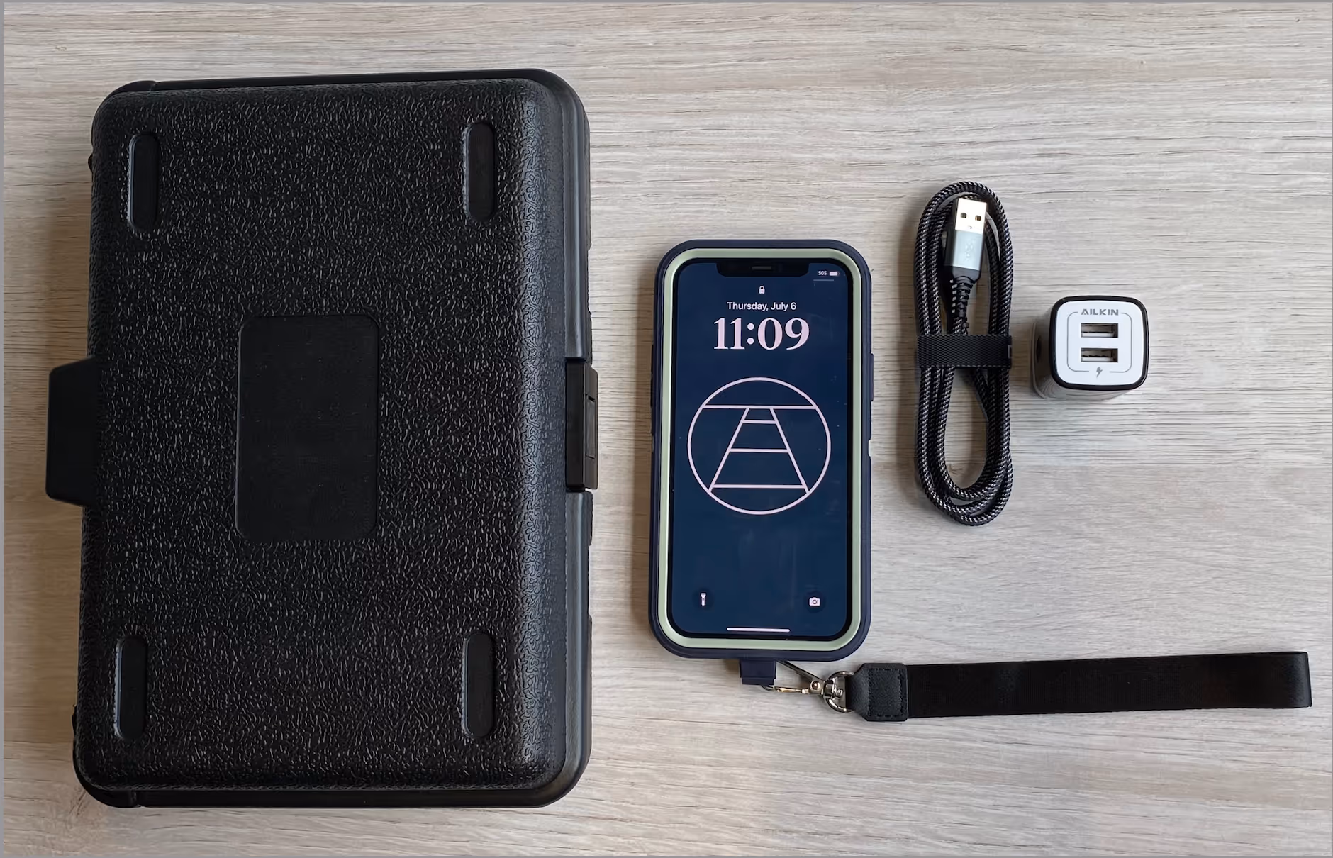 DeepWalk's Rental Phone Program includes a protective shipping container, a compatible iPhone, a charging cable, and a charging block.