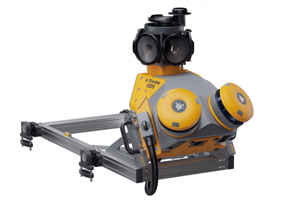 Trimble MX60 mobile mapping system featuring a yellow and gray base with multiple cameras and sensors mounted on a silver aluminum frame.