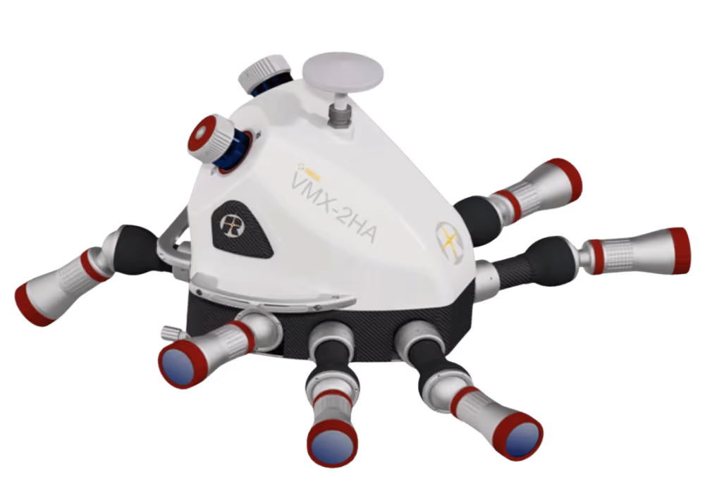 White and black device labeled VMX-2HA with multiple silver cylindrical nozzles with red and blue tips extending from its base.