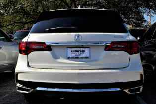 rear view of a white acura suv