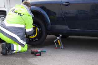 man changing a tire