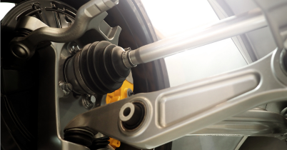 Close-up of a car CV joint and suspension parts