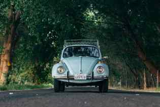 from shot of an old vw beetle on the road