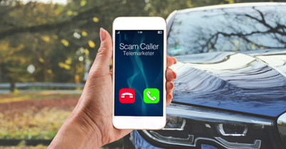 Phone showing 'Scam Caller' with a car in the background.