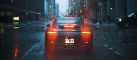 rear view of a car with the brake lights on in a city setting