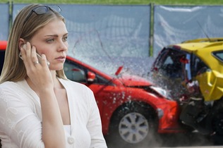 lady in front of two cars crashed into each other