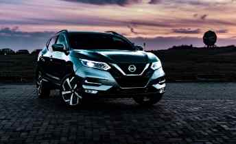 front view of a nissan truck at dusk