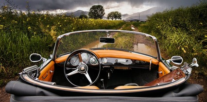 car facing the open dirt road