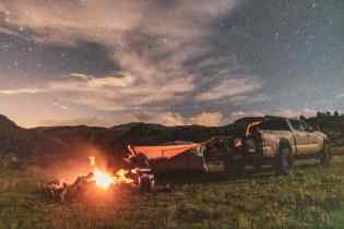 off road vehicle outdoors next to a fire