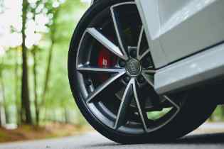 close up of the bottom of a car with the tire turned outward