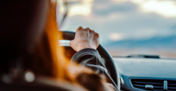 Finger pressing a red “Cancel” key to represent canceling an extended car warranty.