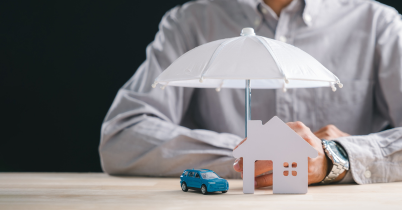 Car insurance agent reviewing protection options with a client to increase revenue per client