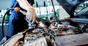 Auto repair shop with vehicle lifts and a car being serviced during rising car repair costs in 2026