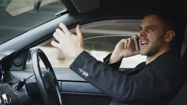 Concerned woman frowning while on the phone