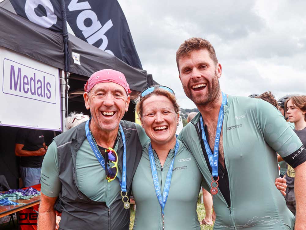 Finishers of the 2025 Dartmoor Classic showing off their well earned medals