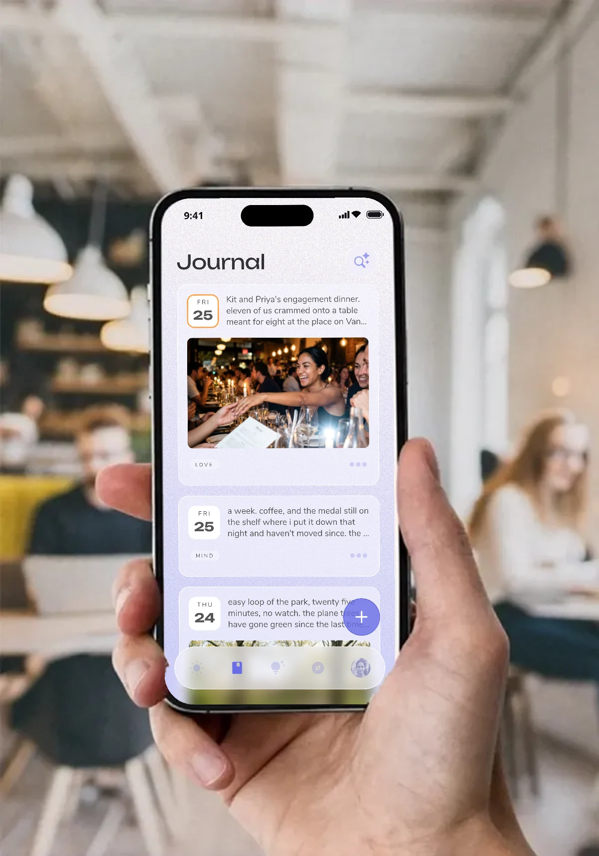 Hand holding an iPhone showing the Reflection journal app