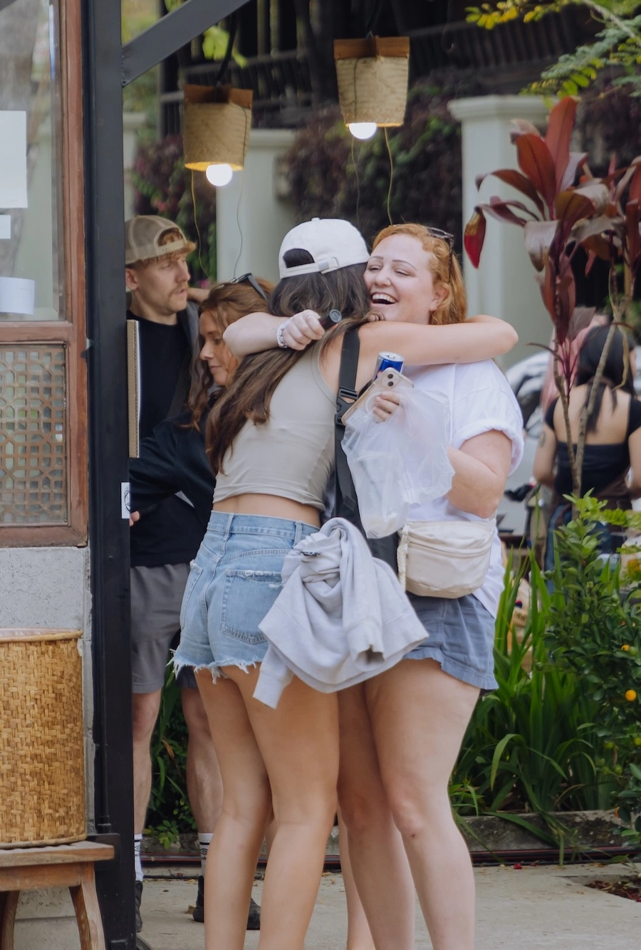 Two friends hugging each other after long time not seeing each other at The Yard Chiang Mai