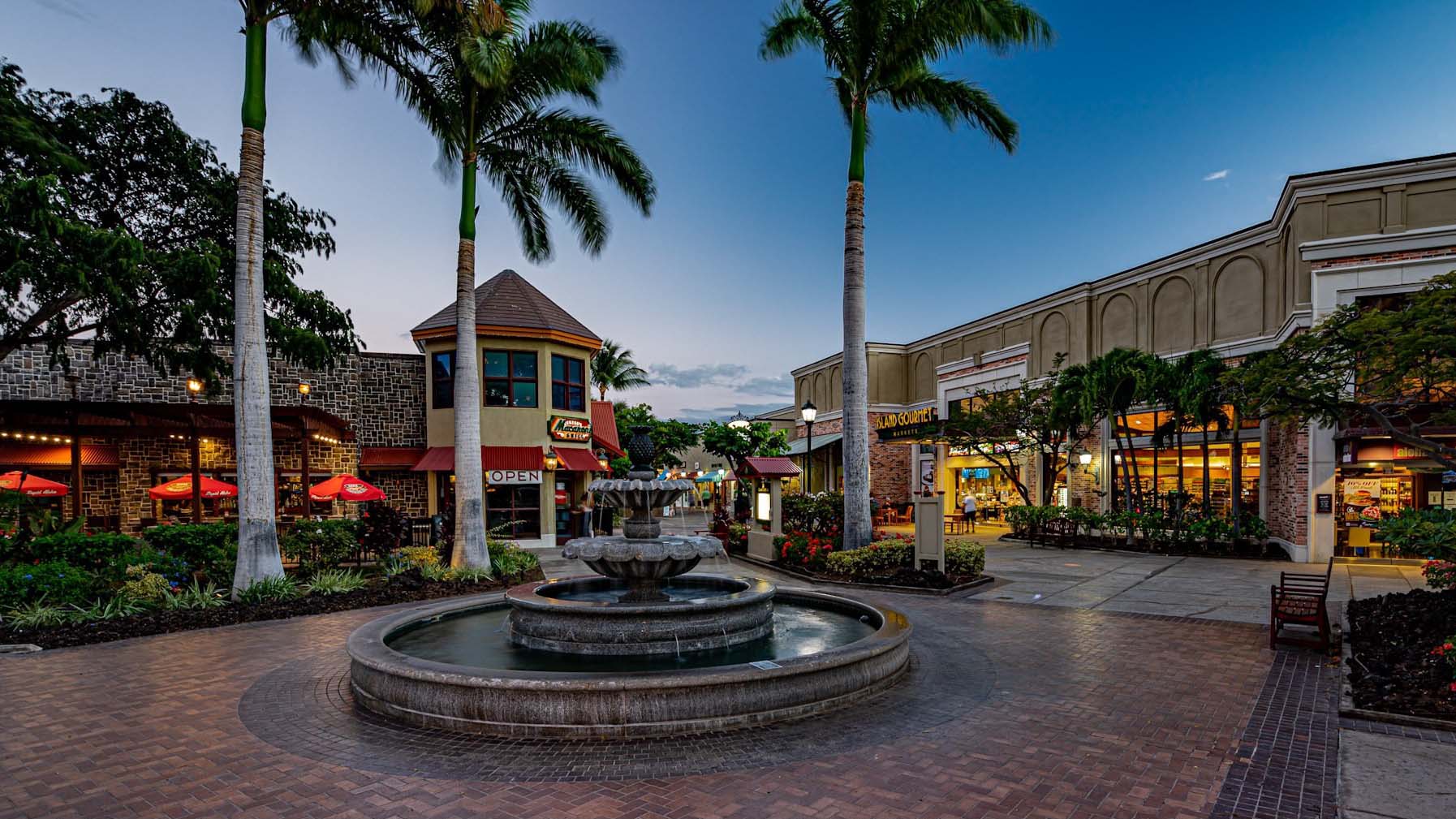 an outdoor marketplace with beautiful landscaping