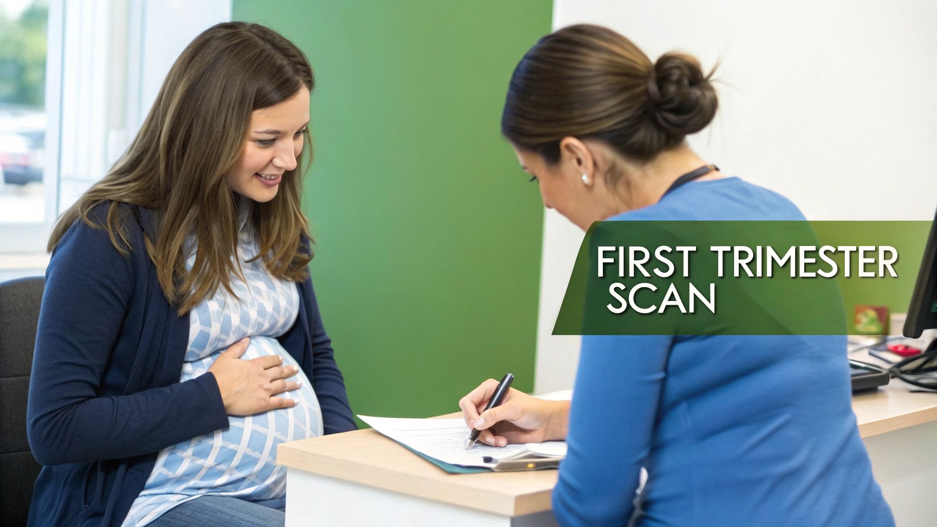 A pregnant woman and a healthcare professional looking at an ultrasound scan on a screen.