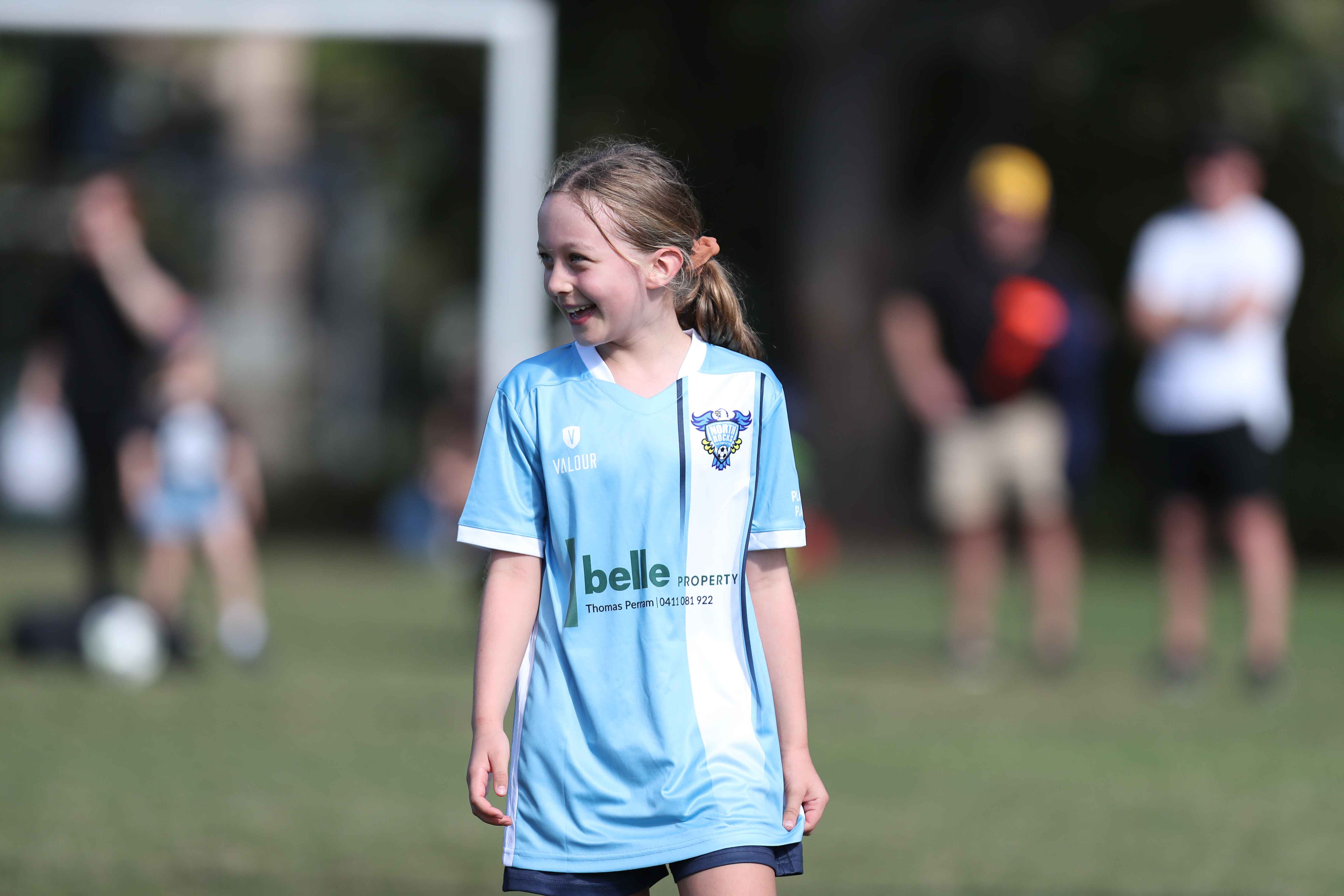 Young girl playing soccer.