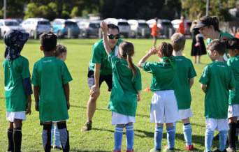 North Rocks logo featuring an eagle with outstretched wings holding a soccer ball, with the motto 'Play Hard Play Fair'.