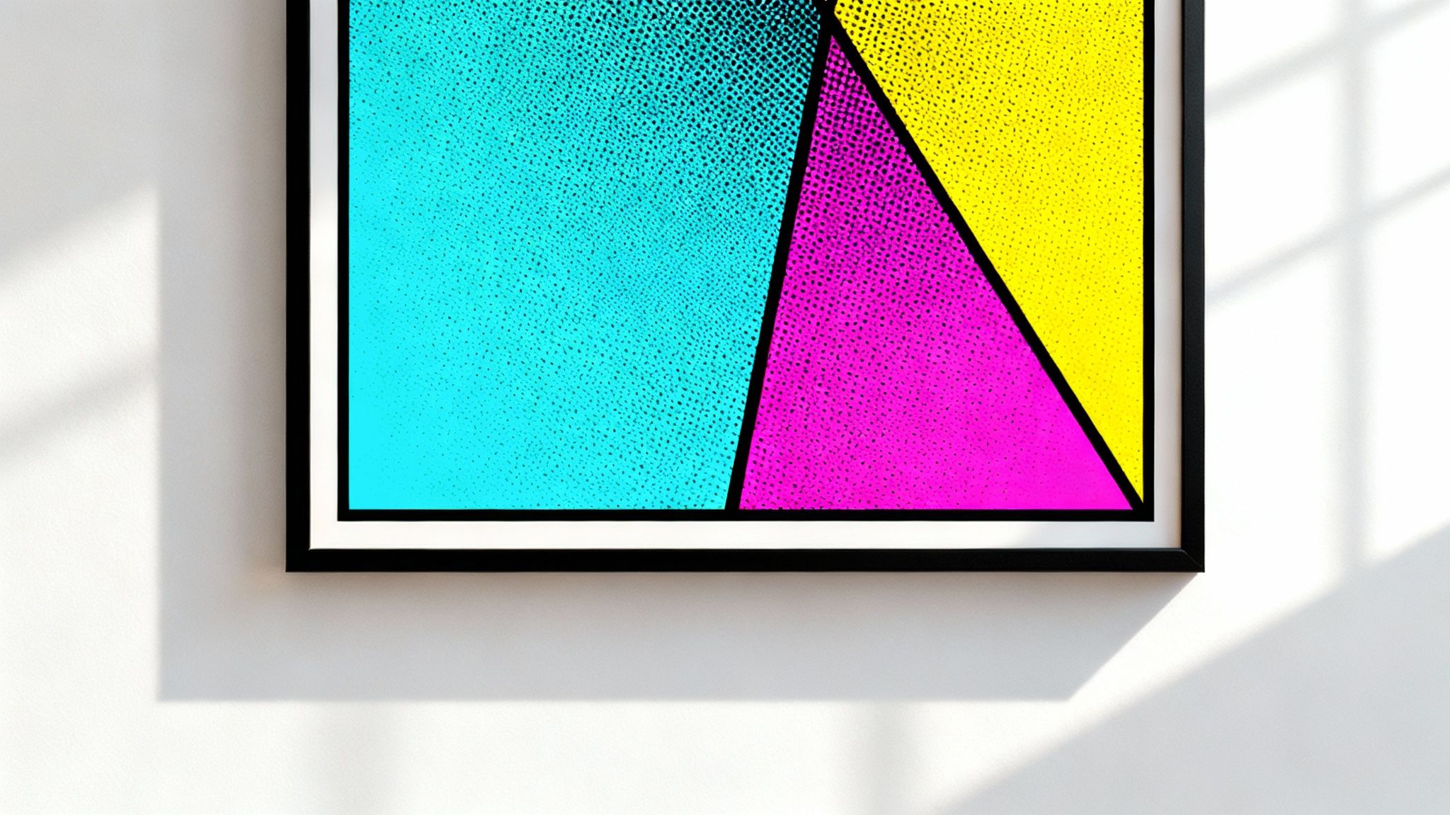 A vibrant pop art poster with cyan,magenta, and yellow geometric shapes hangs on a white wall.