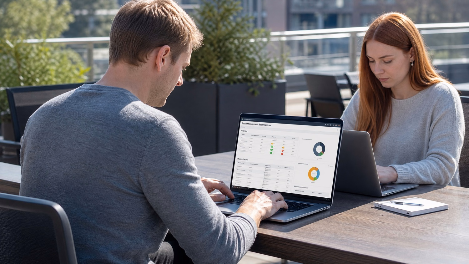 OUTDOOR TERRACE An IT professional one or two people working at a table on a