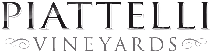 a black and white photo of a vineyard logo