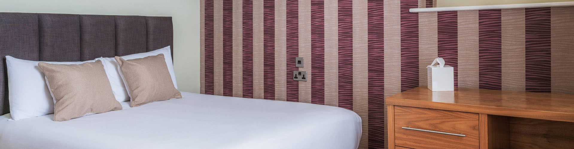 Comfortable double bedroom with modern furnishings at The Esplanade Hotel Llandudno