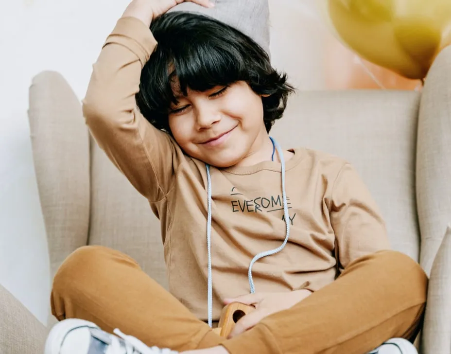 Child engaging in cognitive behavioral therapy session with a therapist