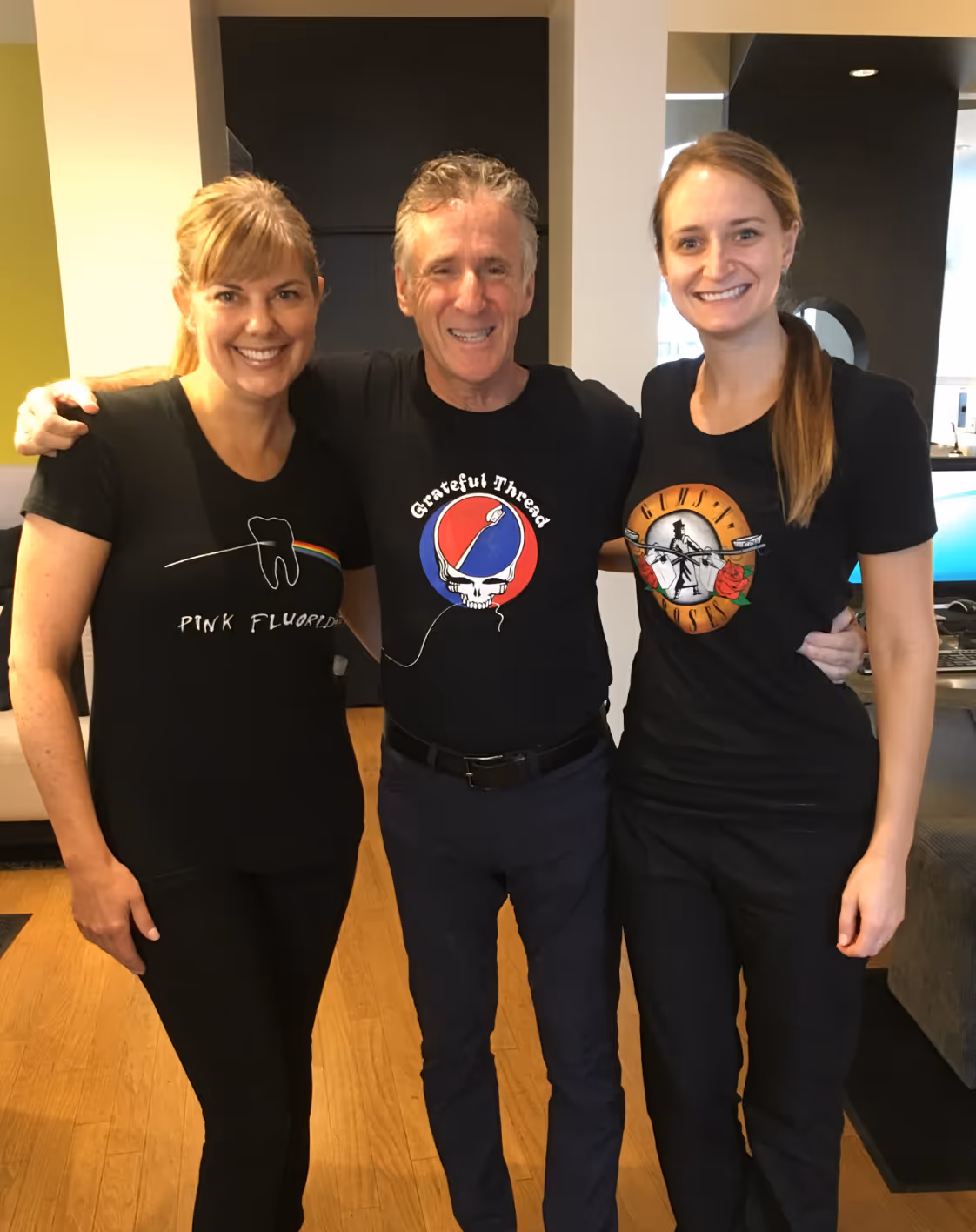 three women wearing Always There Dental Care themed shirts with a retro twist.
